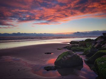 Scenic view of sea against sky at sunset