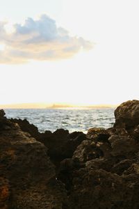 Scenic view of sea against sky at sunset