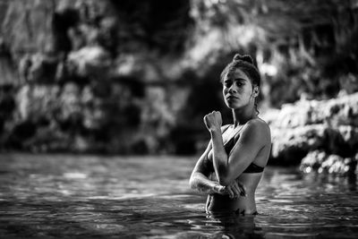 Portrait of woman in lake