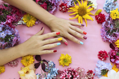 Cropped hand of woman holding bouquet