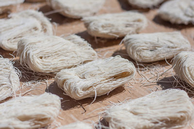 Close-up of raw noodles on table