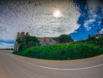 Surface level of road against sky in city