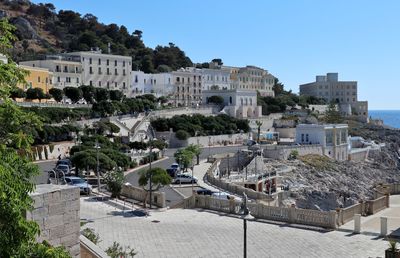 View of buildings in town against clear sky