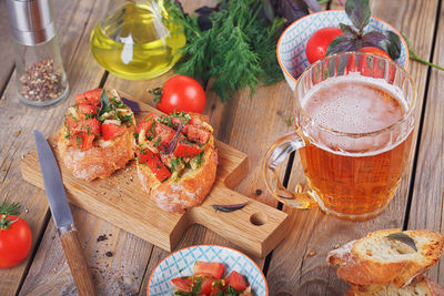 Italian bruschetta with chopped tomatoes, basil, beer and olive oil on grilled crusty bread