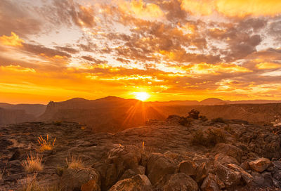 Scenic view of landscape against sky during sunset