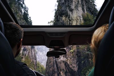 Rear view of man traveling in car