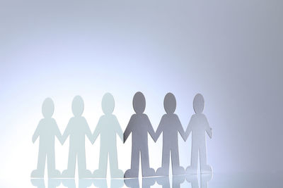 Low angle view of silhouette man against white background