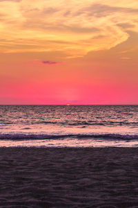 Scenic view of sea against sky at sunset