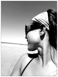 Young man looking away on beach