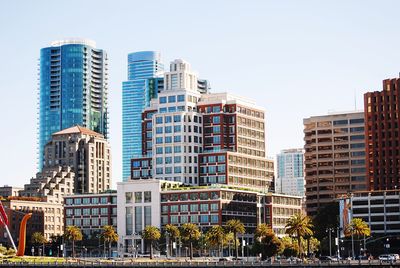 Modern buildings against sky in city