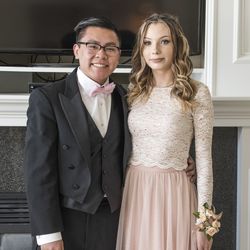 Portrait of wedding guest standing at home