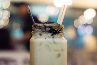 Close-up of glass of jar on table