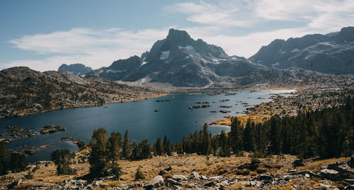 Scenic view of lake and mountains against sky