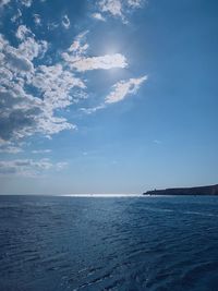 Scenic view of sea against blue sky