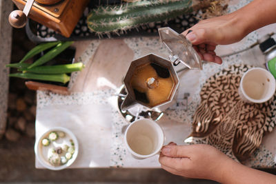 Midsection of woman holding coffee