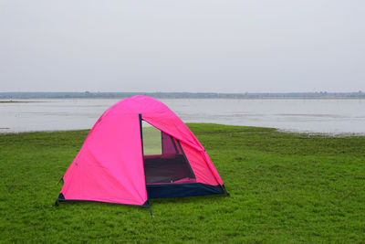 Tent on beach against clear sky