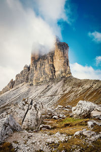 Rock formation on mountain against sky