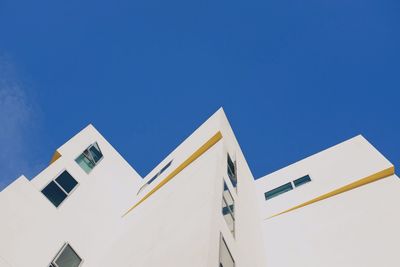 Low angle view of building against clear blue sky