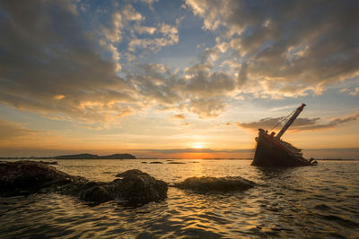 Scenic view of sea against sky during sunset