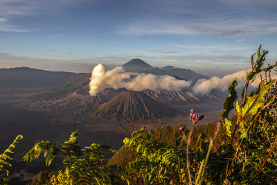 View of volcanic landscape against cloudy sky