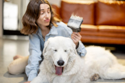 Woman with dog at home