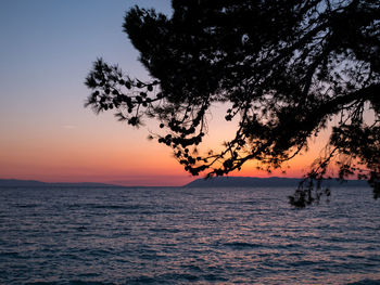 Scenic view of sea against sky at sunset