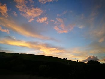 Scenic view of silhouette trees against sky during sunset