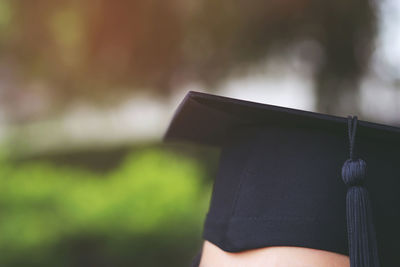 Cropped image of person wearing mortarboard