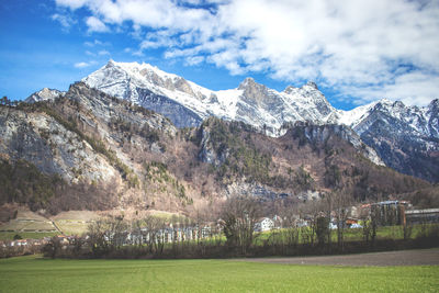 Scenic view of snowcapped mountains against sky