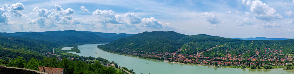 Panoramic view of river and mountains against sky