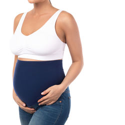 Midsection of woman standing against white background