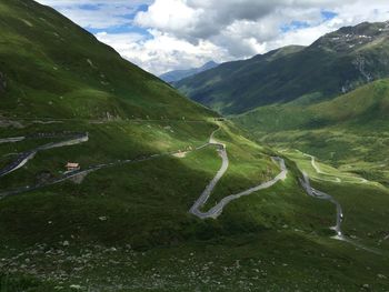 High angle view of mountain roads against cloudy sky