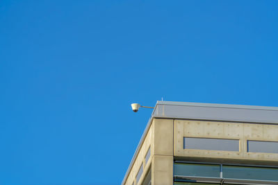 Low angle view of building against clear blue sky