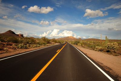 Vast empty open road in arizona on a clear summers day 