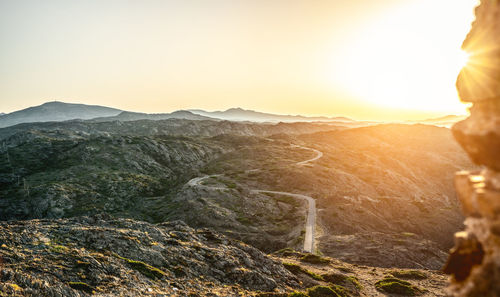 Scenic view of mountains against sky during sunset