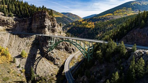 Scenic view of colorado bridge over mountains against sky