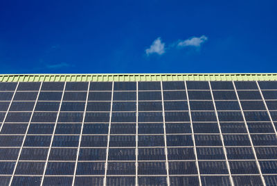 Low angle view of solar panels against sky
