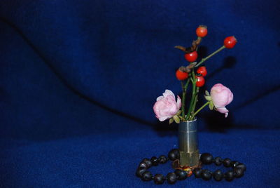 Close-up of red rose on table