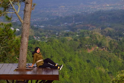 Woman siting on observation point