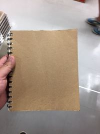 Close-up of hand holding paper