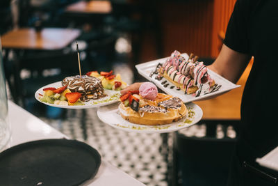 Midsection of woman having food