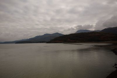 Scenic view of mountains against cloudy sky