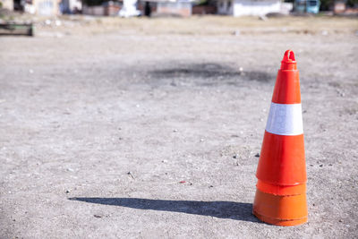 Close-up of traffic cone on road