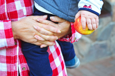 Close-up of man holding hands