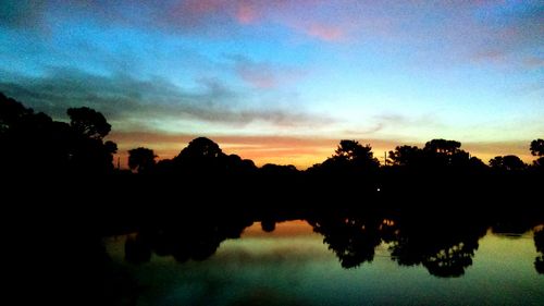 Scenic view of lake at sunset