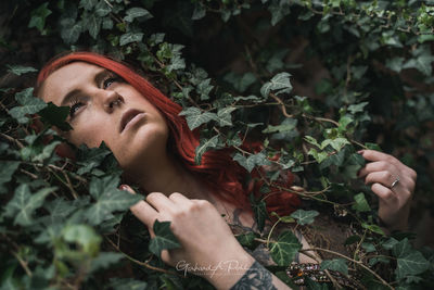Portrait of woman with plants