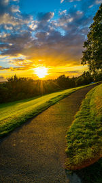 Scenic view of field against sky during sunset