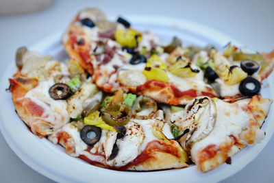 Close-up of pizza served on table