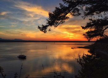 Scenic view of lake at sunset