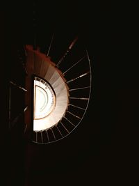 Low angle view of spiral staircase in building